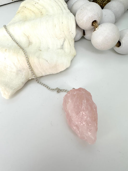 Chunky raw rose quartz is pendulum