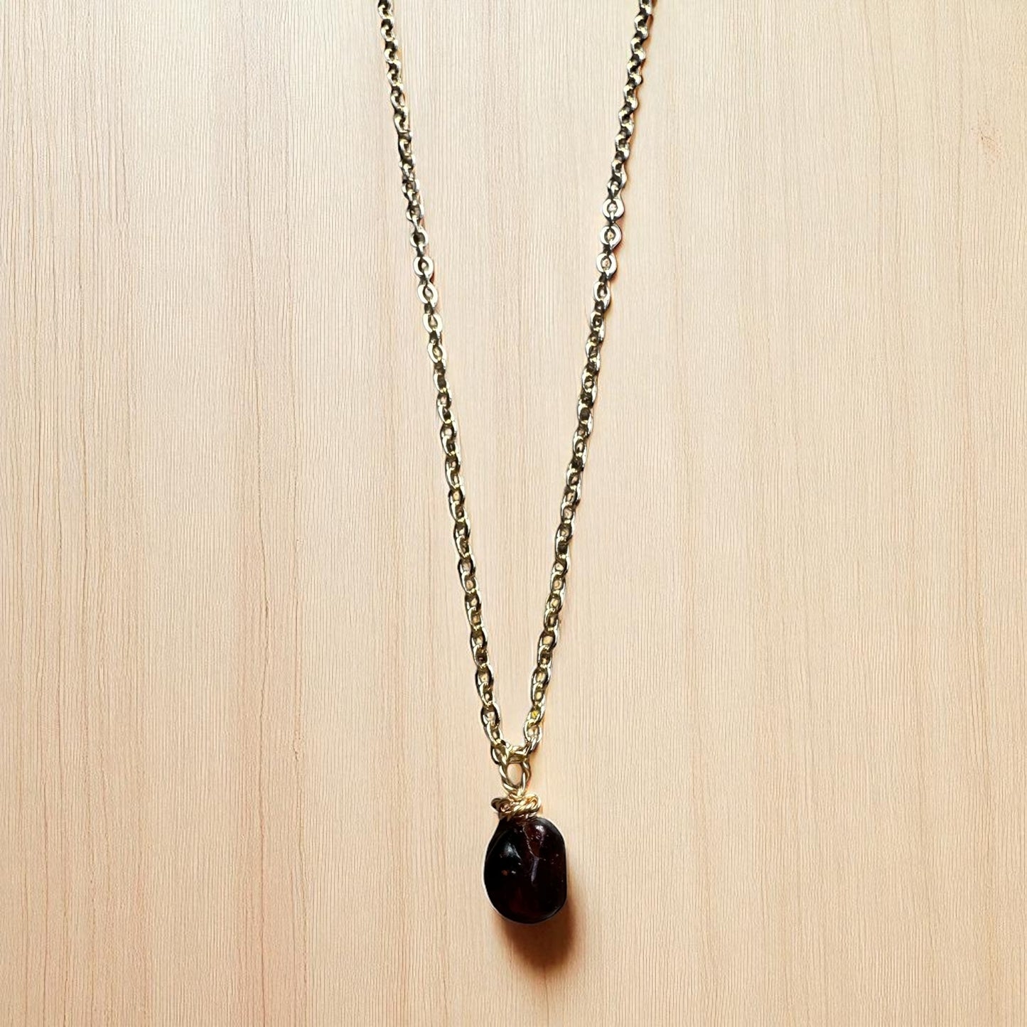 Gold garnet pendant