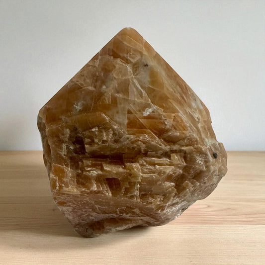Semi polished orange calcite point