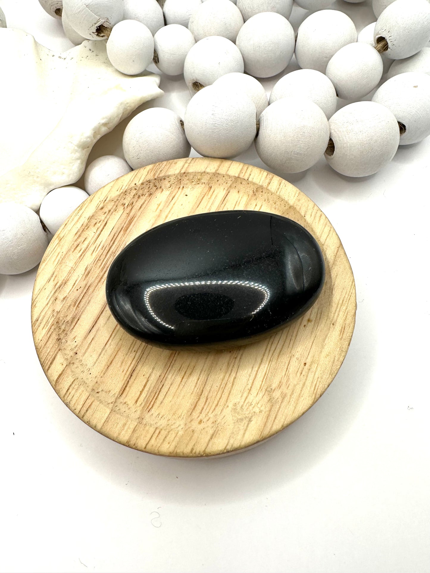 Large black obsidian palm stone